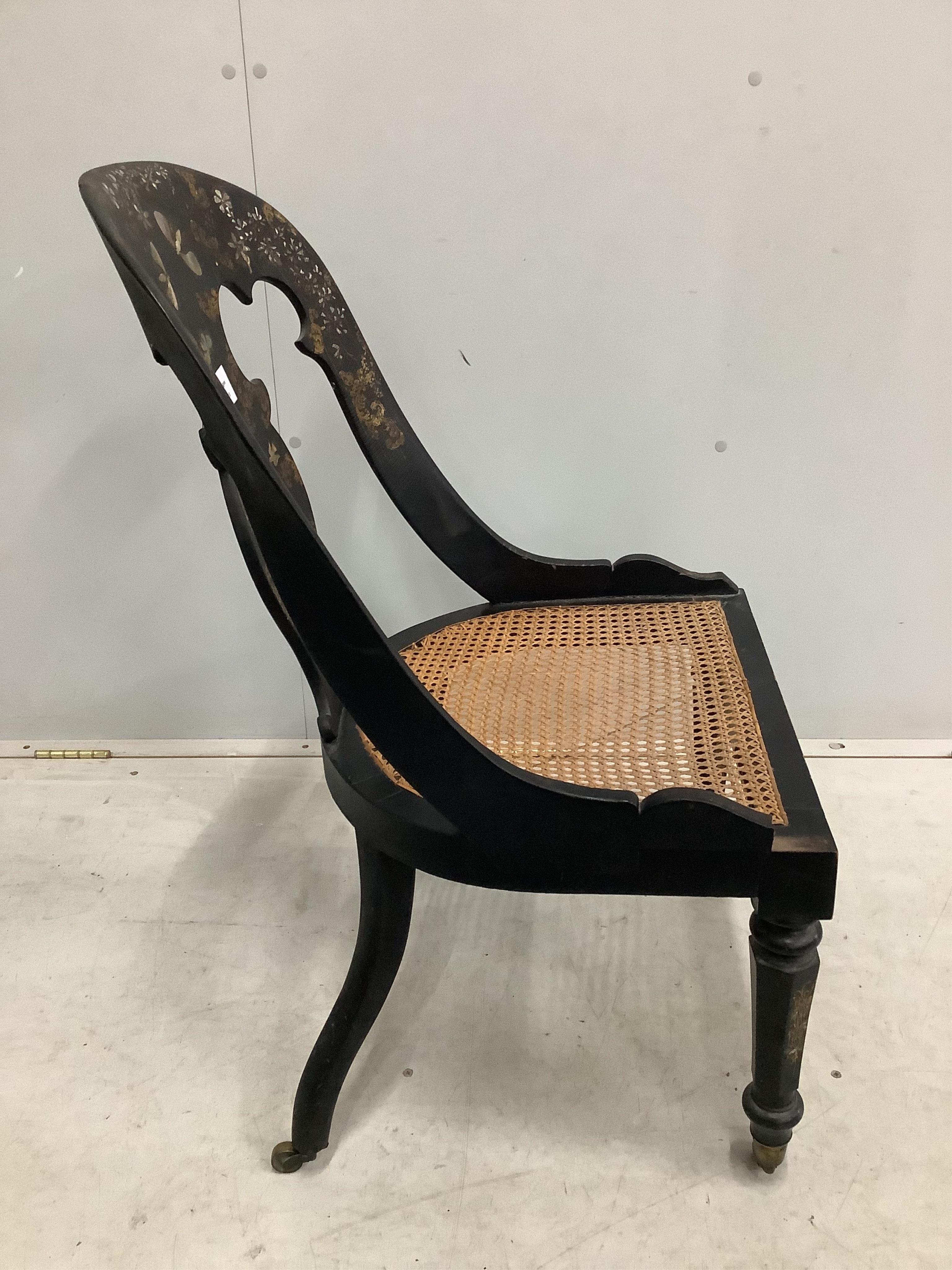 A Victorian mother of pearl inlaid papier mache cane seat chair and a Victorian painted circular tilt top wine table. Condition - fair